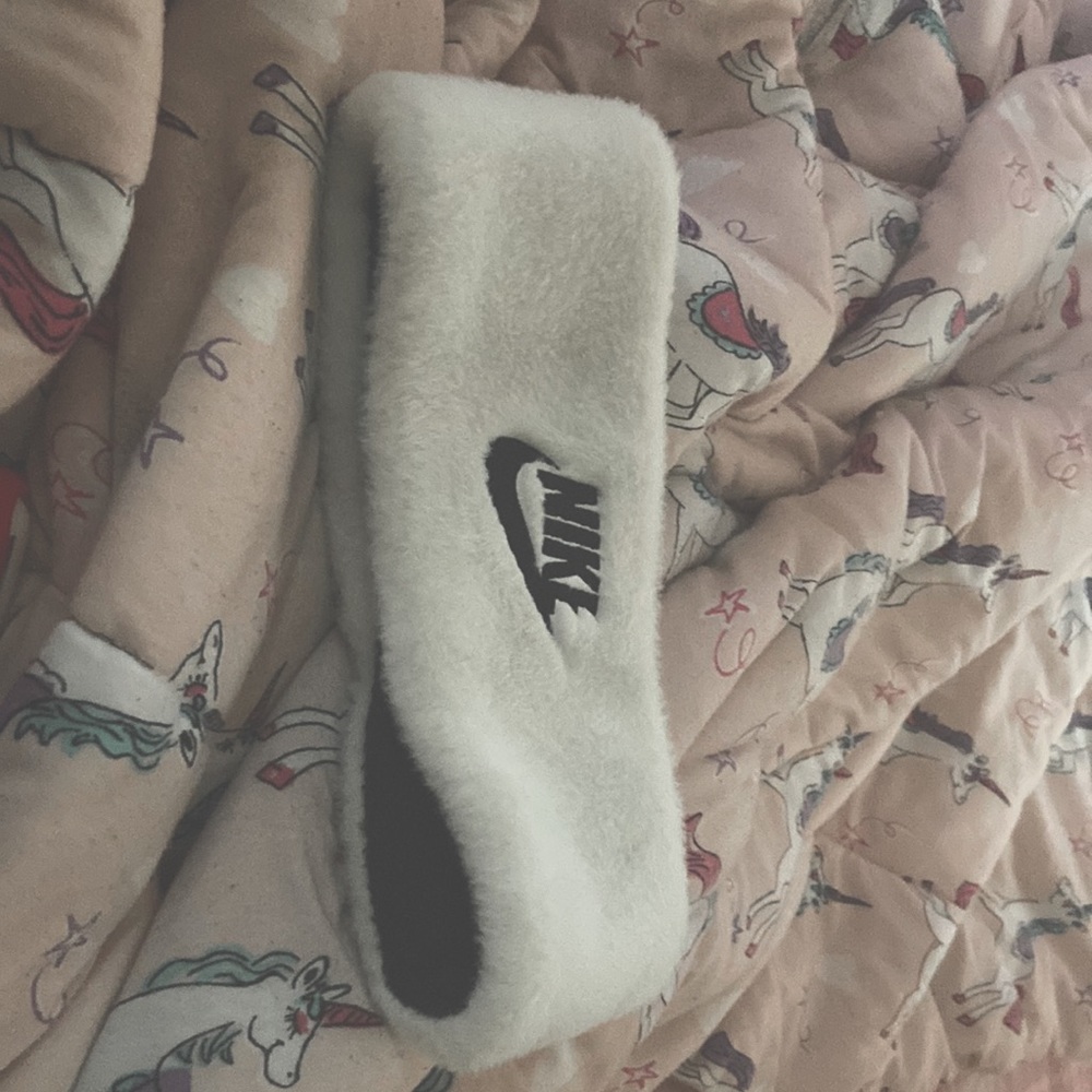 A white and black Nike Headband
